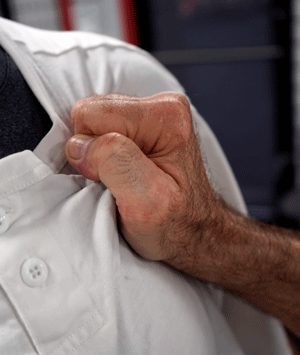 Grasping a chest without using the thumb.